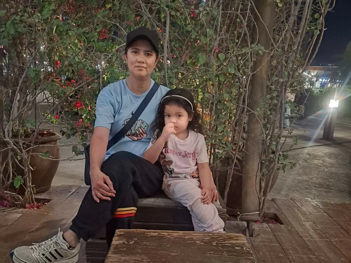Joy, pictured here with her niece, says that the UAE has helped her rebuild her family's life in the Philippines.
