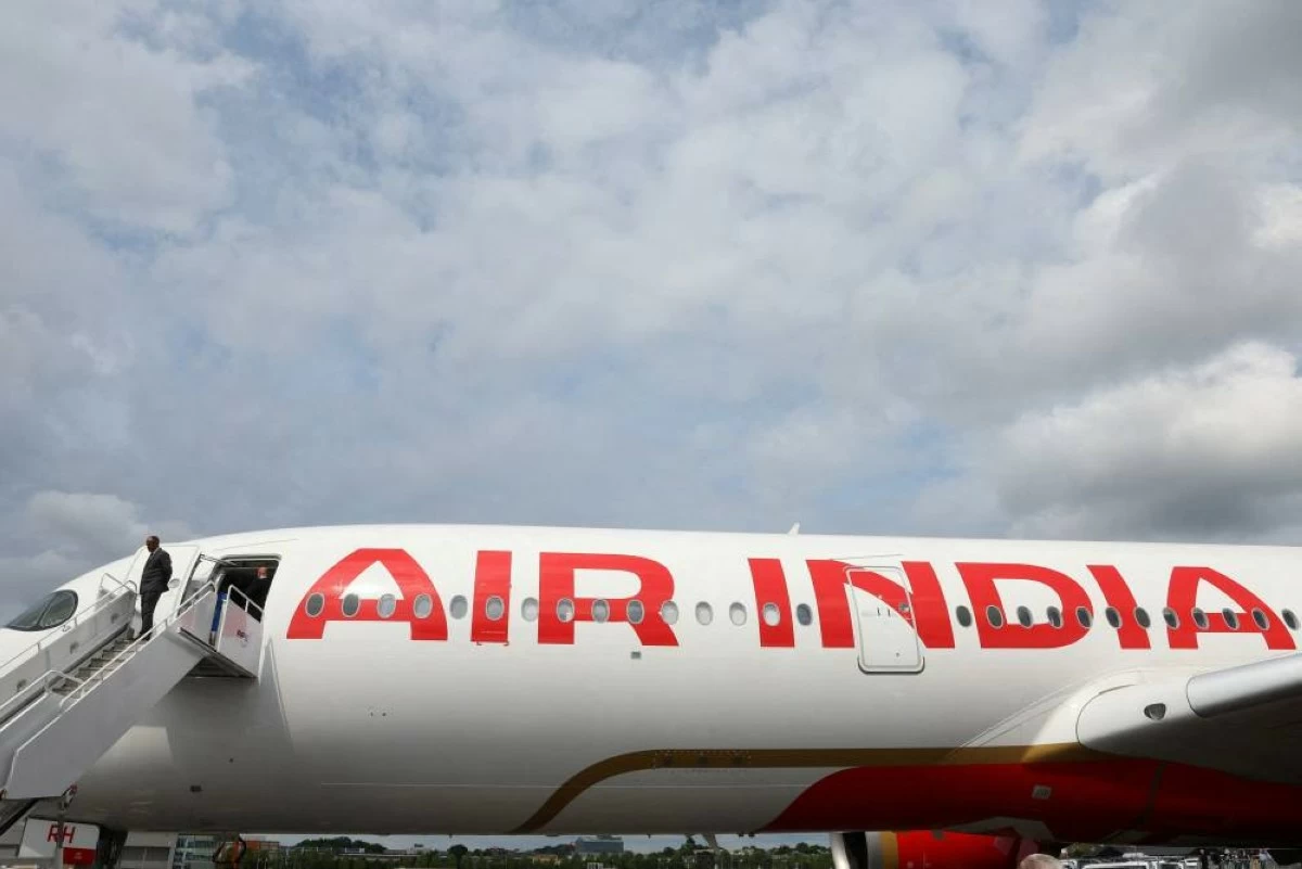 Branding for Air India is seen on an Airbus A350-900 at the Farnborough International Airshow, in Farnborough, Britain, July 24, 2024. REUTERS/Toby Melville/File Photo
