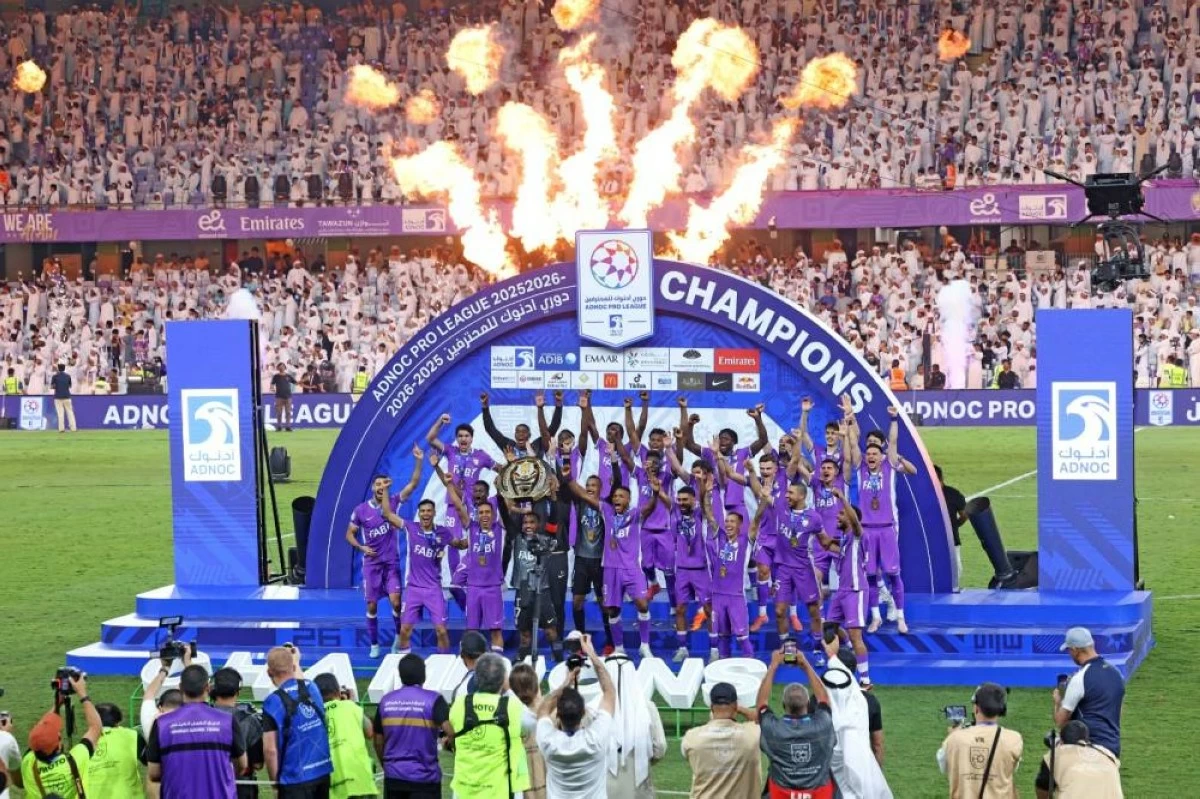 Al Ain FC celebrate with the champions' trophy after defeating Dibba FC 4-0 at Hazza Bin Zayed Stadium in Al Ain during the Adnoc Pro League Final in Al Ain, May 16, 2026. (Photo by Ibrahim Sadek)
