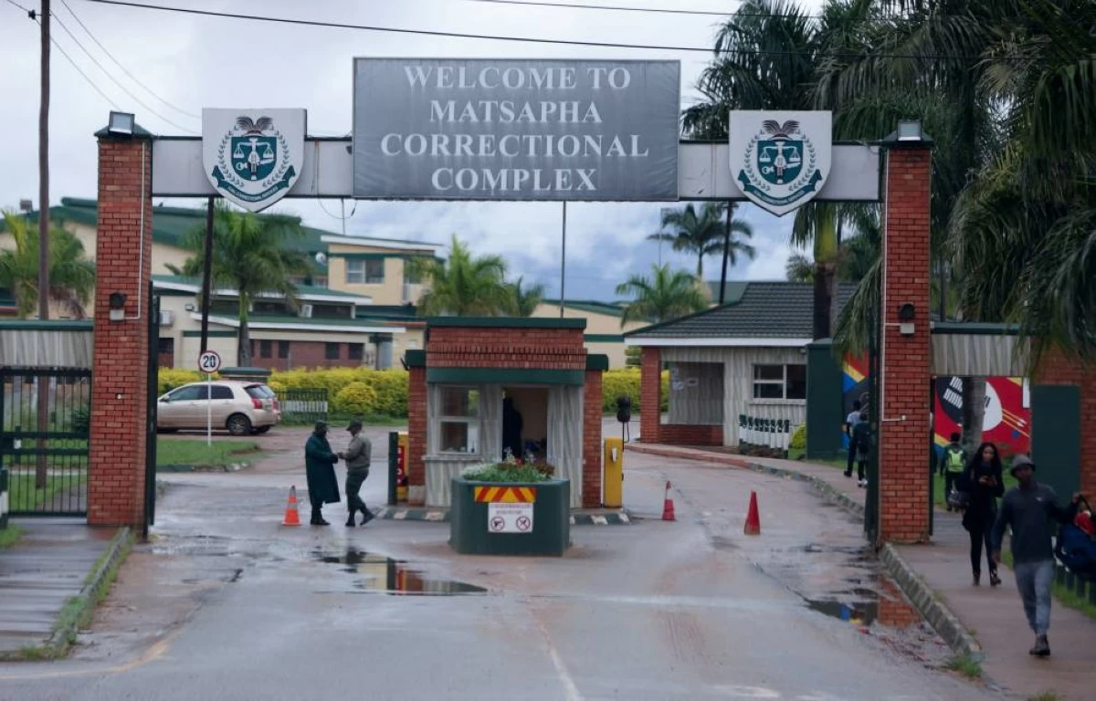 Workers and visitors walk near the entrance to Matsapha Correctional Complex, a maximum-security prison known for holding high-profile detainees, near Manzini, Eswatini's second-largest city, April 23, 2026. REUTERS/Oupa Nkosi