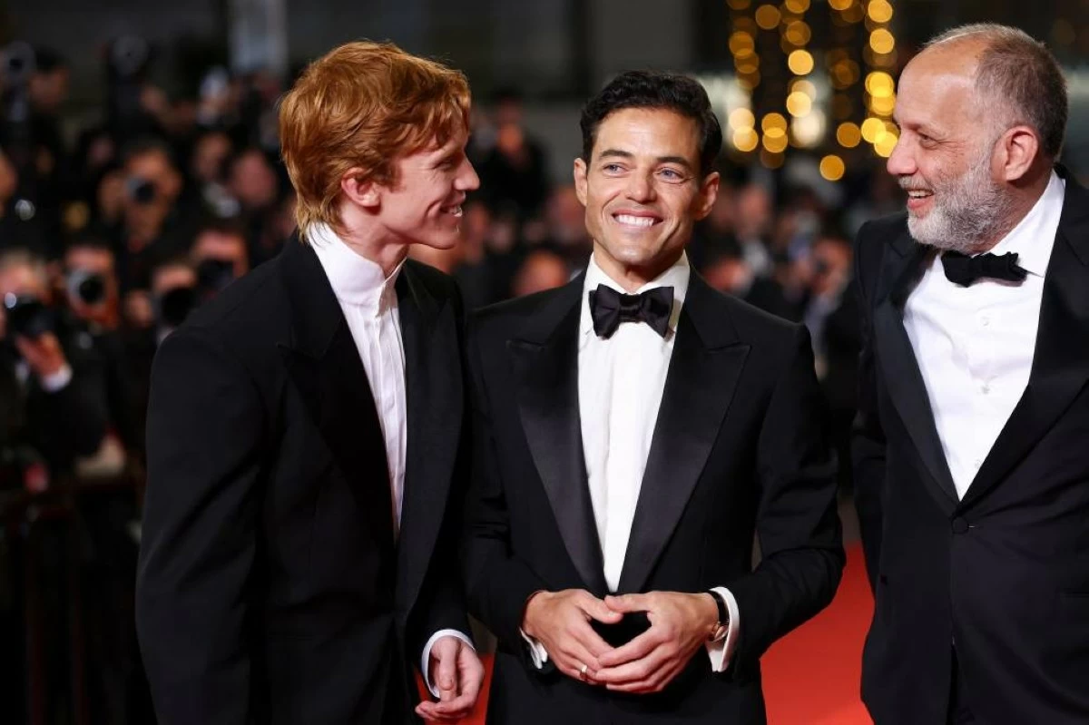 Director Ira Sachs, cast members Rami Malek and Luther Ford talk on the red-carpet during arrivals for the screening of the film "The Man I Love" in competition at the 79th Cannes Film Festival in Cannes, France, May 20, 2026. REUTERS/Gonzalo Fuentes