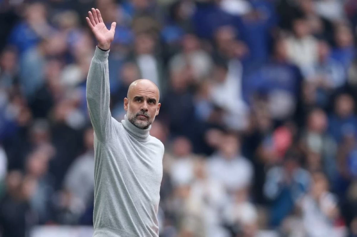 Manchester City's head coach Pep Guardiola greets fans before the English FA Cup final soccer match between Chelsea and Manchester City in London, Saturday, May 16, 2026. (AP Photo/Richard Pelham, File)