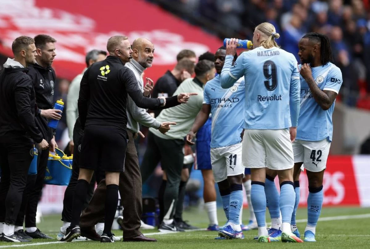 Manchester City manager Pep Guardiola gives instructions to Erling Haaland, Antoine Semenyo and Jeremy Doku during their match with Chelsea Wembley Stadium, London, Britain - May 16, 2026. (Reuters)