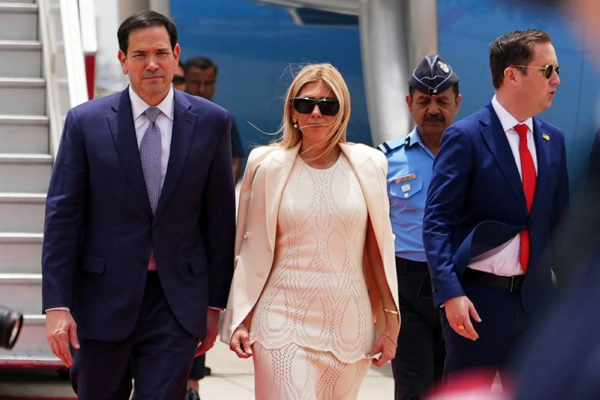 United States Secretary of State Marco Rubio and his wife Jeanette disembark their plane along with US Ambassador to India Sergio Gor, right, at Indira Gandhi International Airport in New Delhi, India, Saturday, May 23, 2026. (AP Photo)