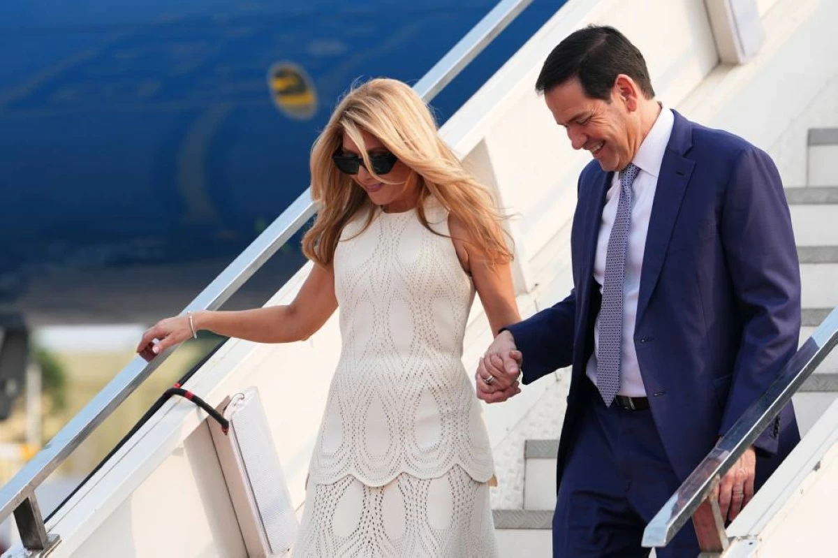 United States Secretary of State Marco Rubio disembarks his plane with his wife Jeanette at Netaji Subhash Chandra Bose International Airport in Kolkata, India, Saturday, May 23, 2026. (AP Photo)