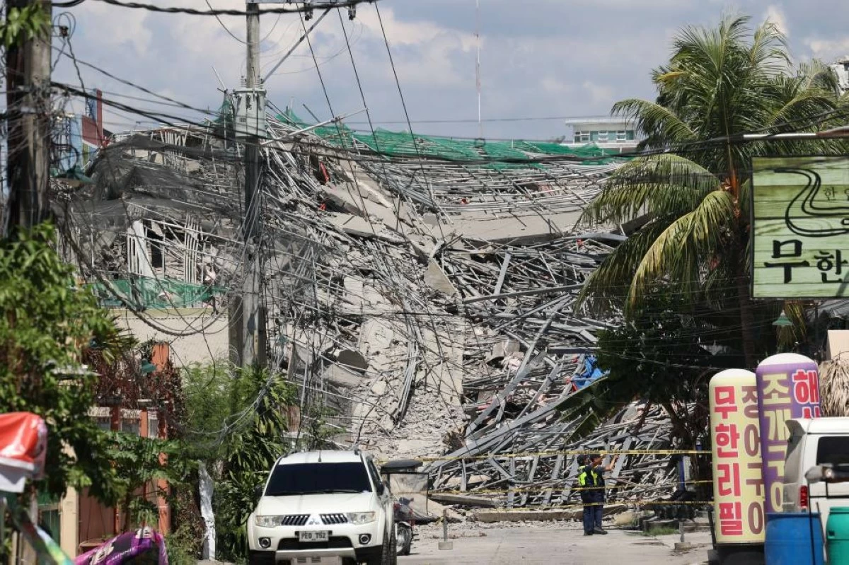 Caution tape marks the area around a collapsed building in Angeles city in Pampanga province, north of Manila, Sunday May 24, 2026. Picture: AP
