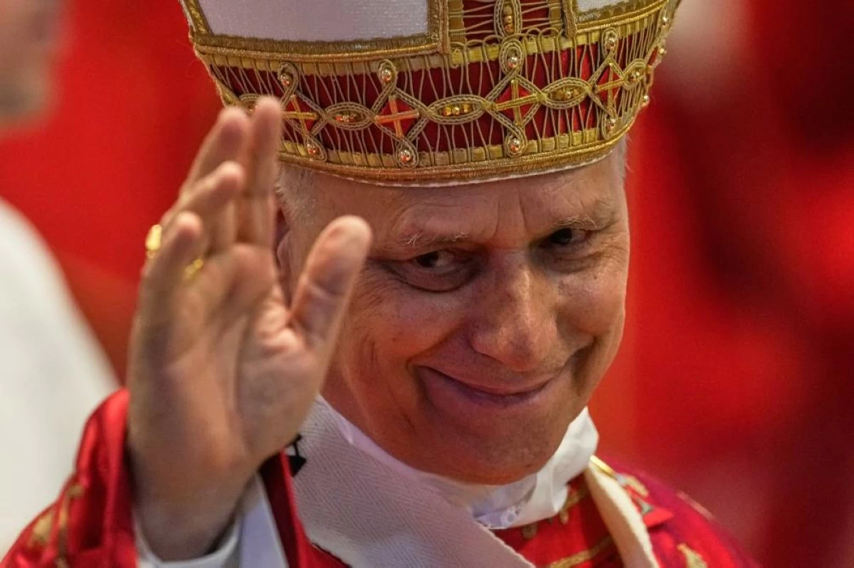 Pope Leo XIV waves to faithful at the end of the Pentecost Mass in St. Peter's Basilica, at the Vatican, Sunday, May 24, 2026. AP