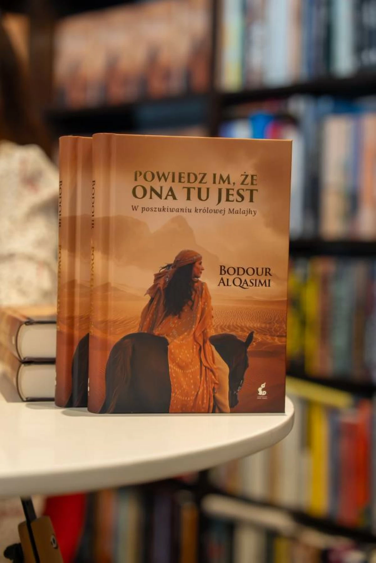 The cover of Sheikha Bodour's book 'Let Them Know She Is Here: Searching for the Queen of Mleiha', at the launch event in Warsaw. (Supplied)