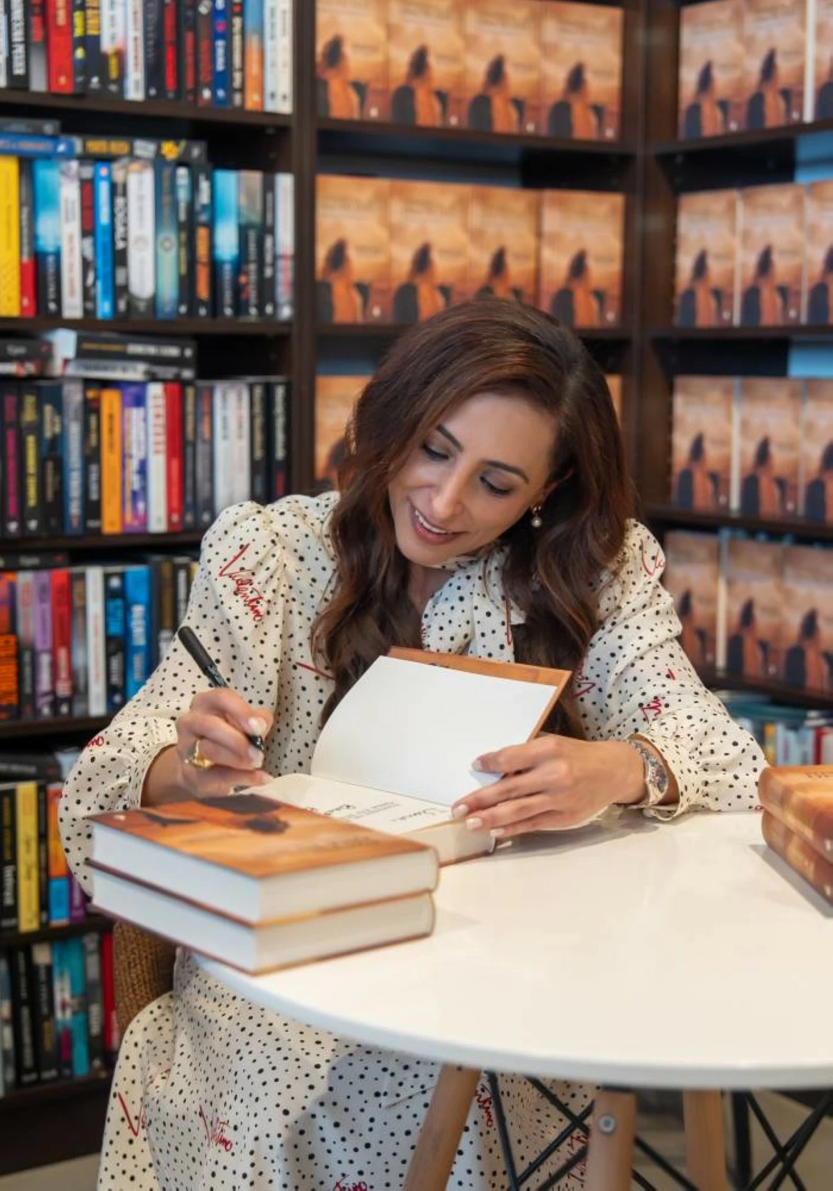Sheikha Bodour autographs her book ‘Let Them Know She Is Here: Searching for the Queen of Mleiha’, at the launch event in Warsaw.