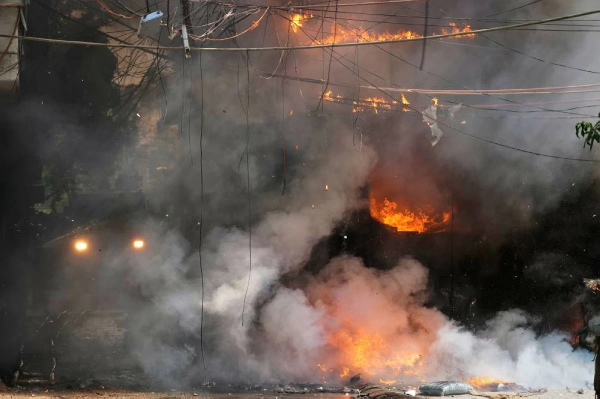 Firefighters try to douse a fire at a hotel in New Delhi, India, Wednesday, June 3, 2026. (AP Photo/Manish Swarup)