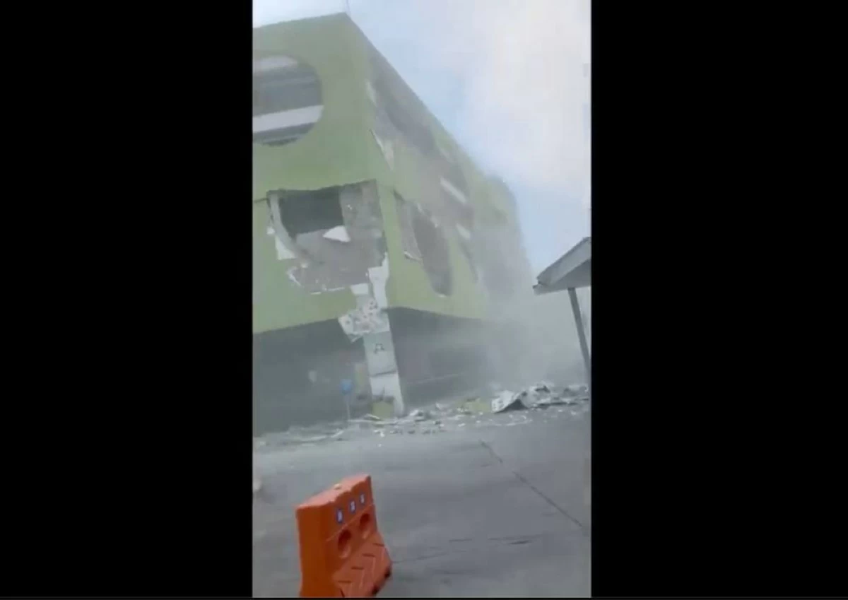 This image from a video shows dust and debris outside a building after a powerful earthquake in General Santos city on the island of Mindanao, Philippines Monday, June 8, 2026. AP