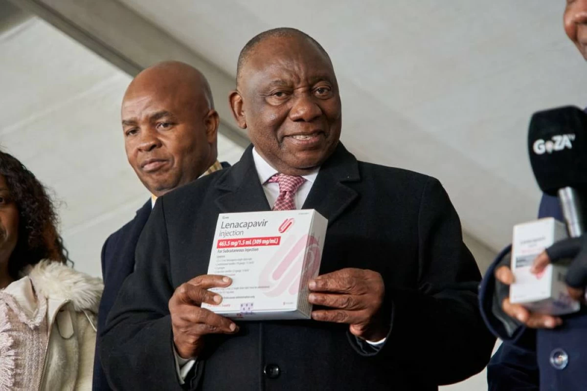South African President, Cyril Ramaphosa holds a box of Lenacapavir during the official launch of the drug's rollout programme in Secunda, South Africa, Friday, June 5, 2026. (AP Photo/Kayleen Morgan)