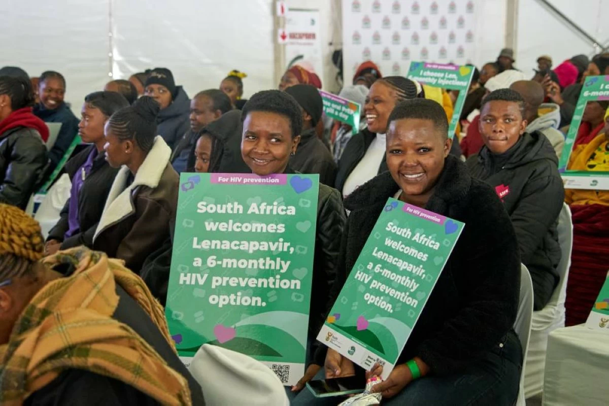 Young people hold posters as they attend the launch of the Lenacapavir rollout programme in Secunda, South Africa, Friday, June 5, 2026. (AP Photo/Kayleen Morgan)