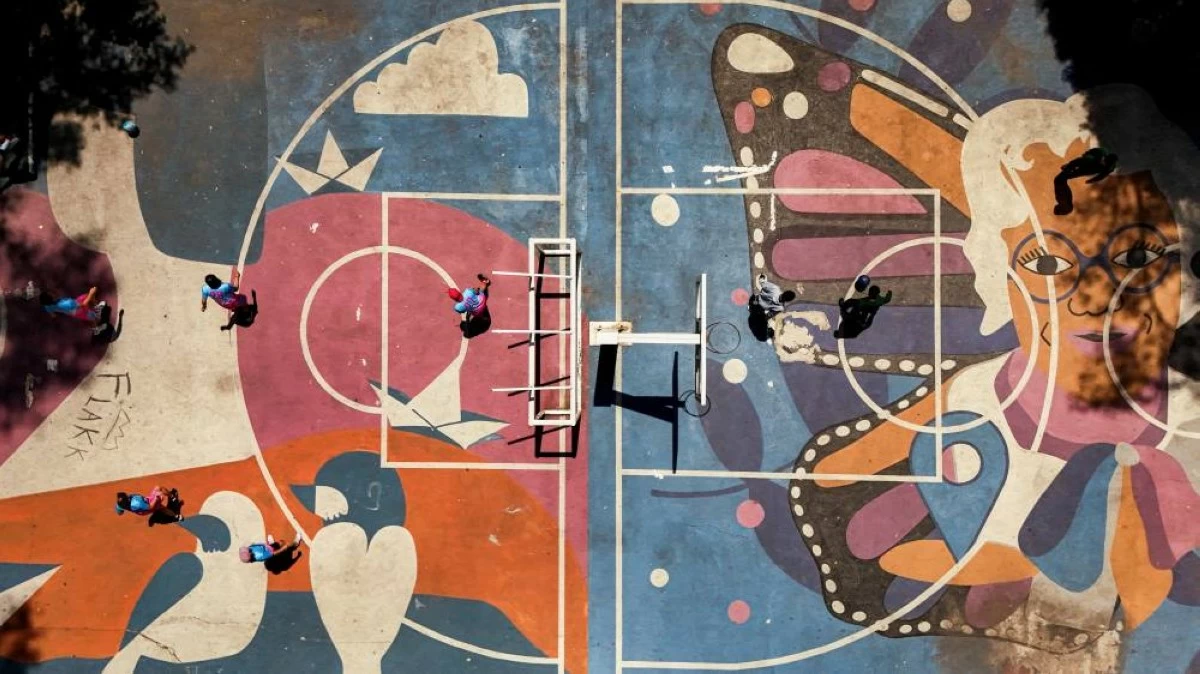 A drone view shows a painted football pitch in the Tlatelolco housing complex, where matches are held by the Sharks group to promote sport within the LGBTQA  community, in Mexico City, Mexico, April 18, 2026. REUTERS/Raquel Cunha 