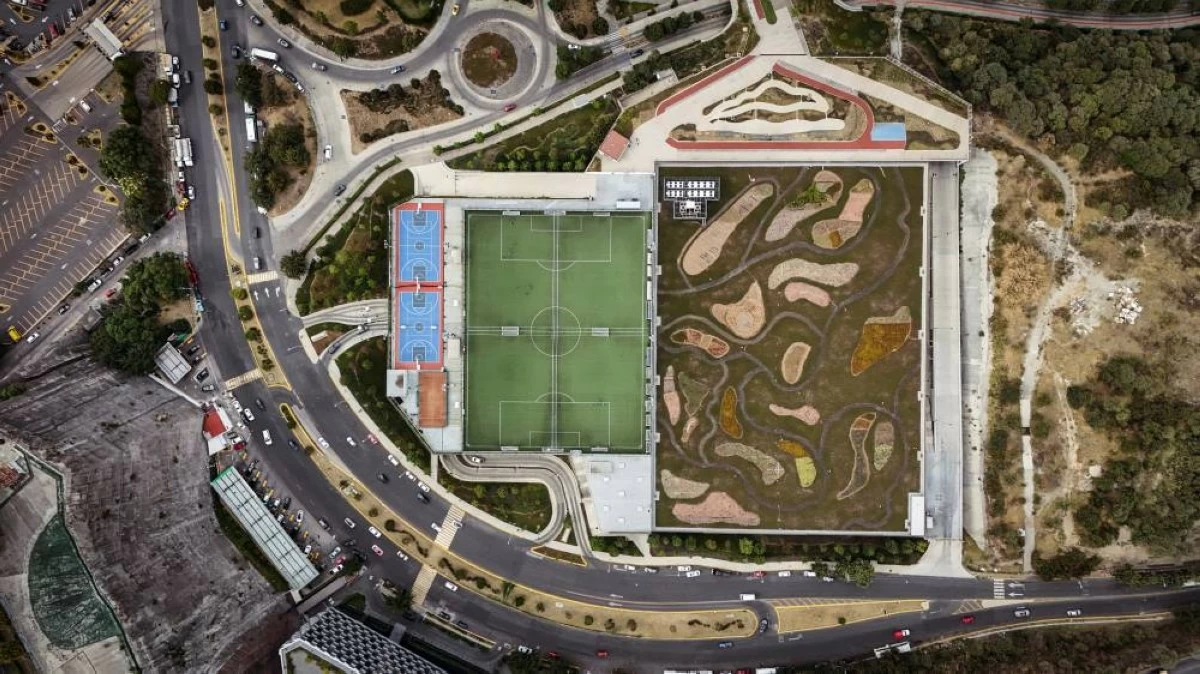 A drone view shows a sports field on the rooftop of a Costco branch, part of the Parque La Mexicana complex next to a large green roof with 21 varieties of native plants and grasses in the Santa Fe business district, in Mexico City, Mexico, April 15, 2026. REUTERS/Raquel Cunha