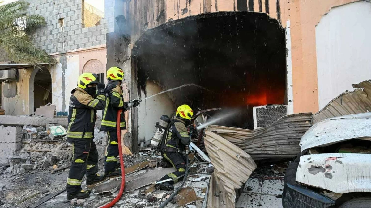 Bahrain says debris from intercepted Iranian drones injures 