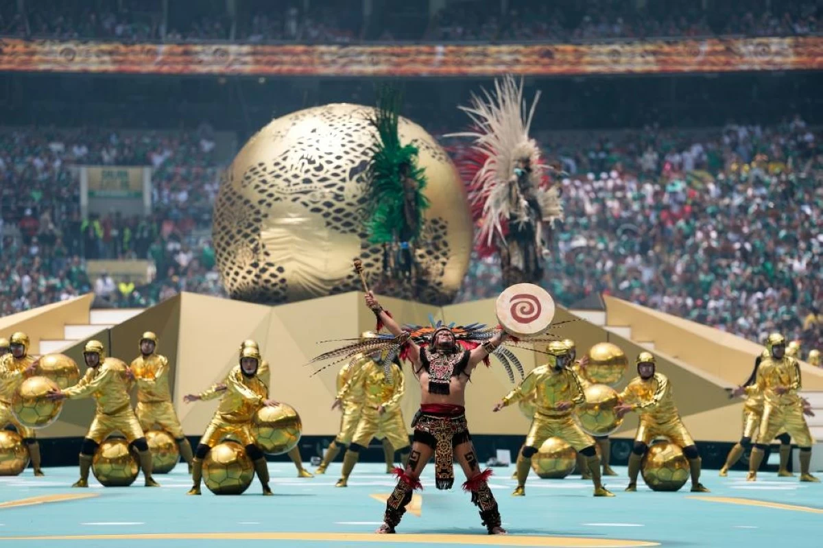 Performers on the pitch during the opening ceremony before the start of the World Cup Group A soccer match between Mexico and South Africa in Mexico City. Picture credit: AP