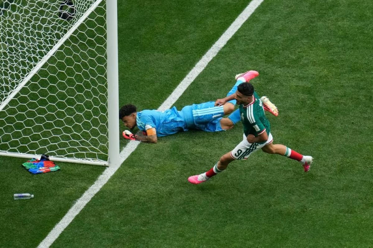 Mexico's Raul Jimenez scores his side's second goal during the World Cup Group A soccer match between Mexico and South Africa in Mexico City, Thursday, June 11, 2026. (AP Photo/Ricardo Mazalan)