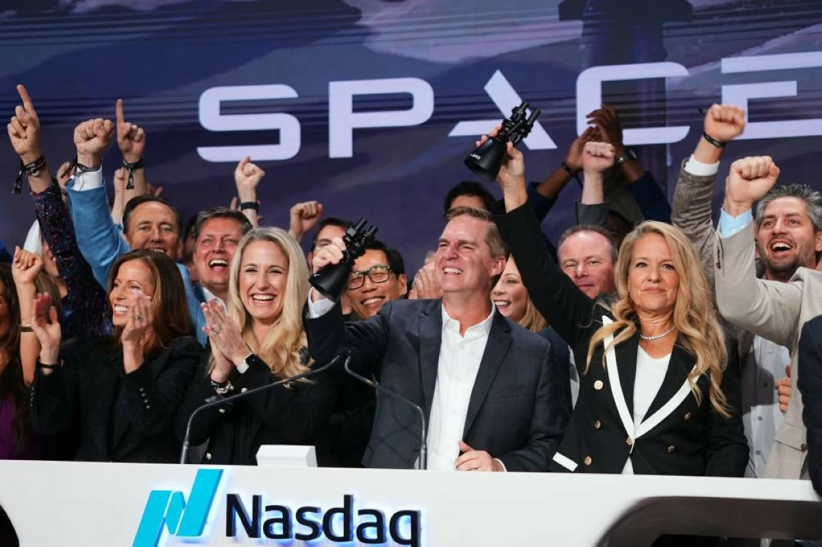 Gwynne Shotwell, President and COO of SpaceX, right, celebrates with colleagues during a bell ringing ceremony for the IPO of SpaceX at the Nasdaq MarketSite in New York, Friday, June 12, 2026, in New York. (AP)