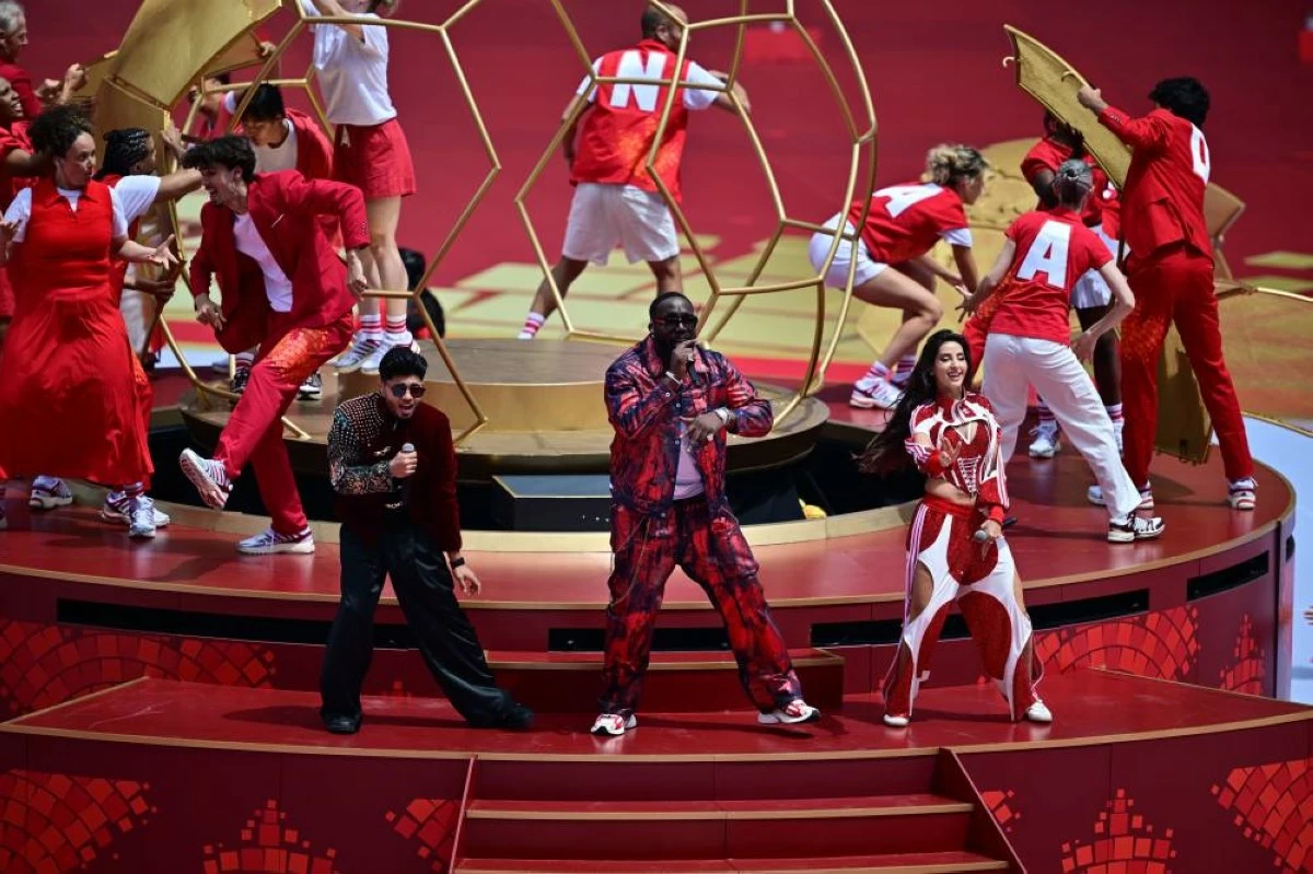 Singers Sanjoy, Nora Fatehi and Vegedream, from left, perform during the opening ceremony. Picture credit: AP