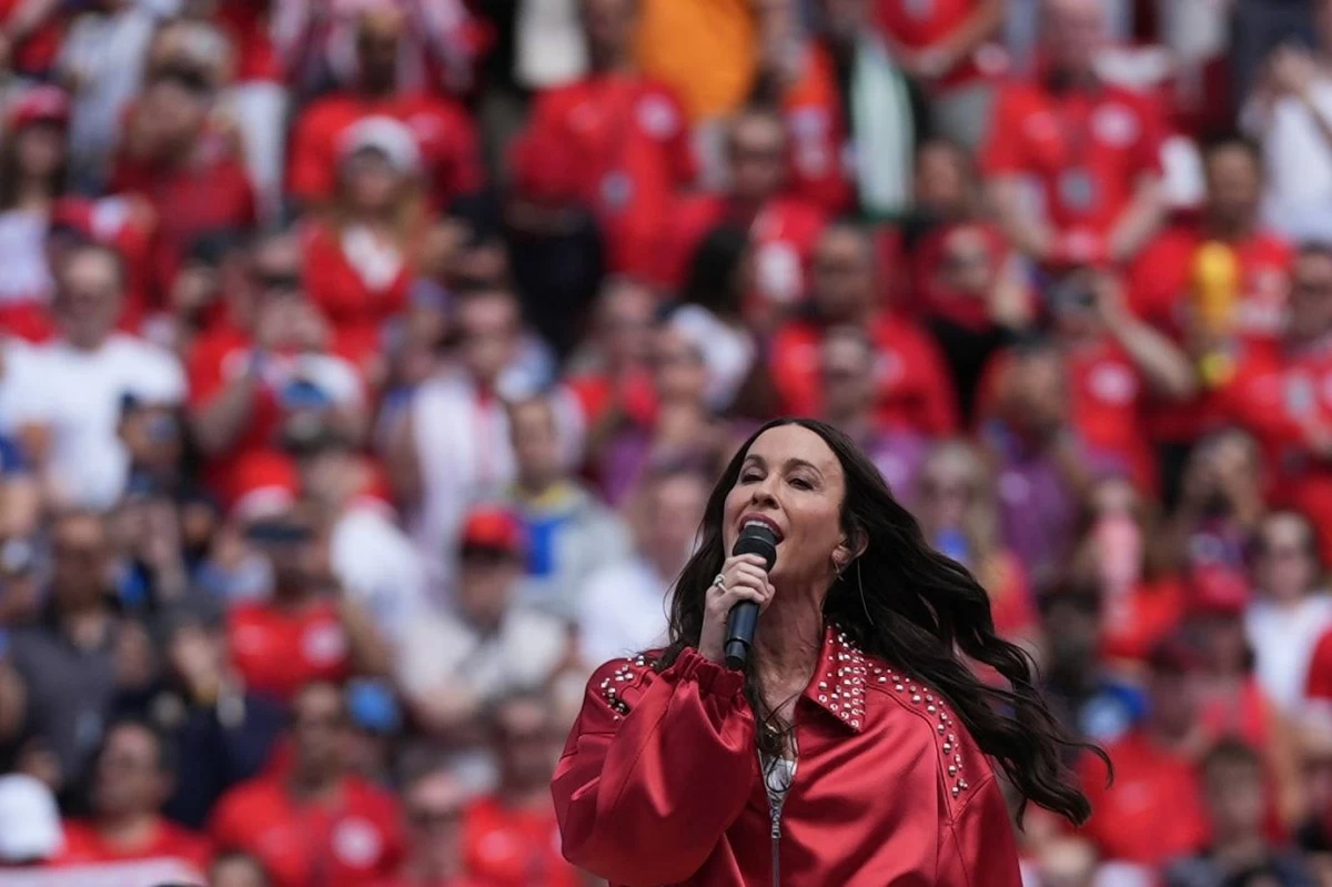 Alanis Morisette performs the Canadian national anthem during the World Cup Group B match. Picture credit: AP