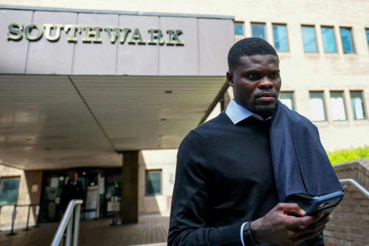 Ghana national team and Villarreal midfielder Thomas Partey, who is facing two additional counts of rape and has pleaded not guilty to five counts of rape and one count of sexual assault, leaves the Southwark Crown Court in London, Britain, April 13, 2026. REUTERS/