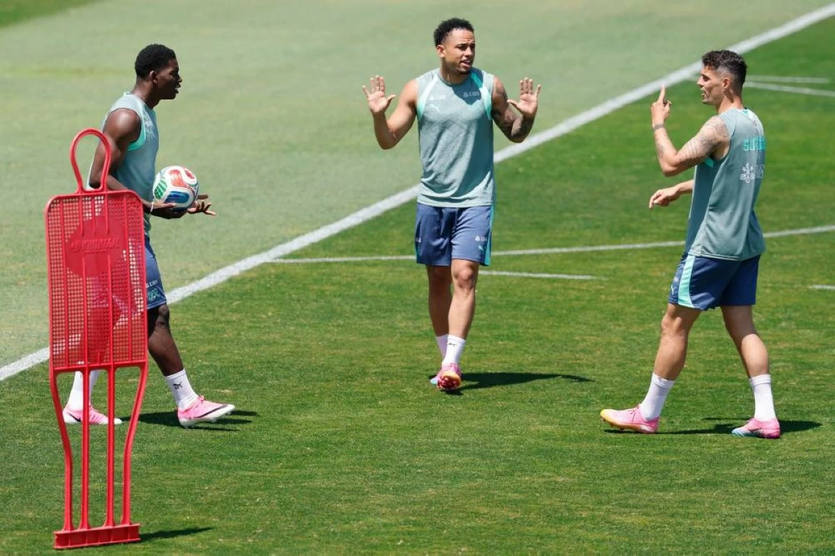 From left: Switzerland's Breel Embolo, Noah Okafor and Granit Xhaka argue during a training session for the national soccer team, Tuesday, June 9, 2026, in San Diego, ahead of the World Cup soccer tournament. (AP)