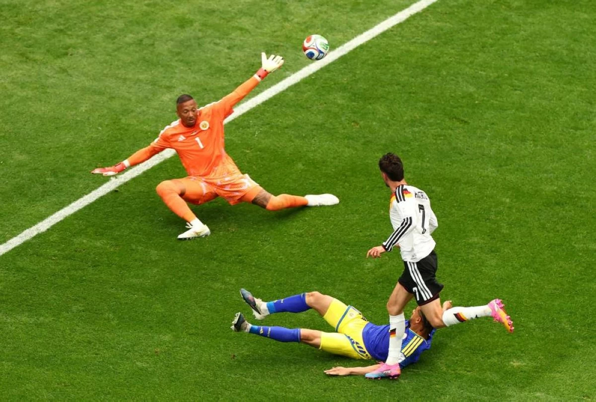 Germany's Kai Havertz scores their seventh goal past Curacao's Eloy Room. REUTERS