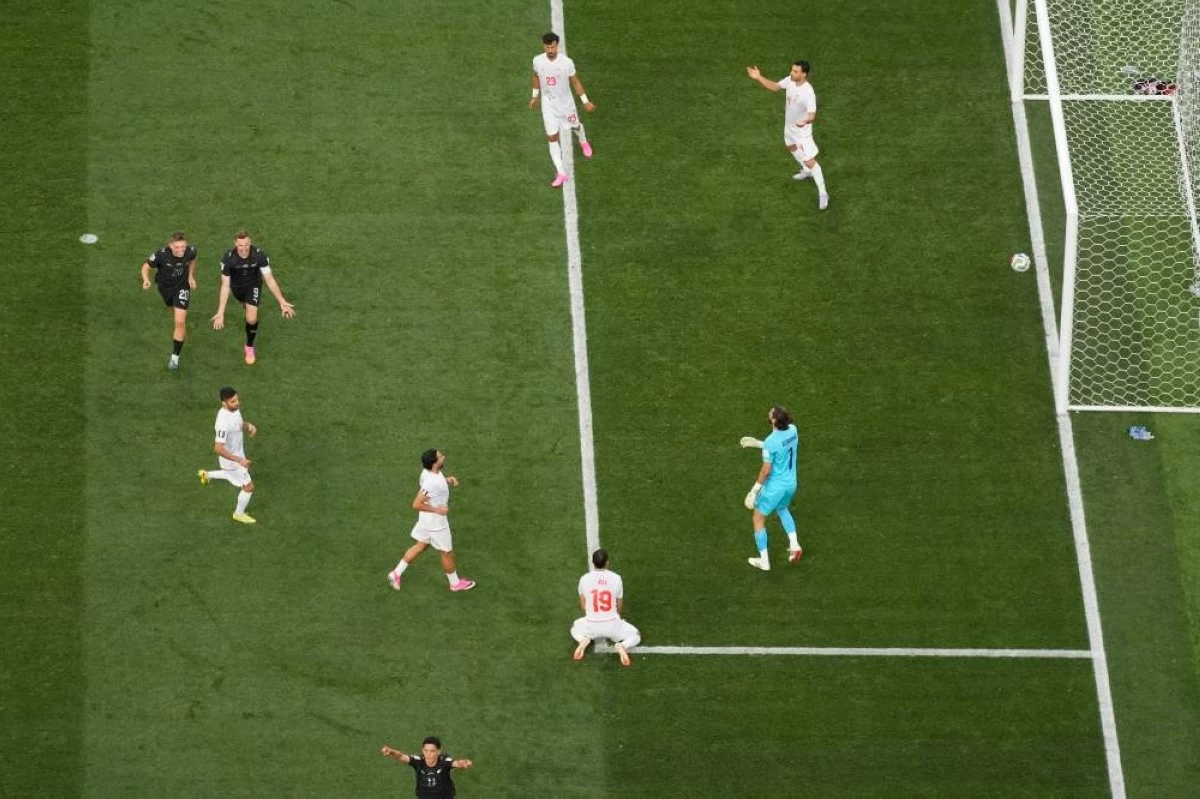 Iran players react after New Zealand's Elijah Just (11), bottom, scored their second goal during the World Cup Group G soccer match between Iran and New Zealand in Inglewood, Calif., near Los Angeles, Monday, June 15, 2026. (AP Photo/Andre Penner) (AP)