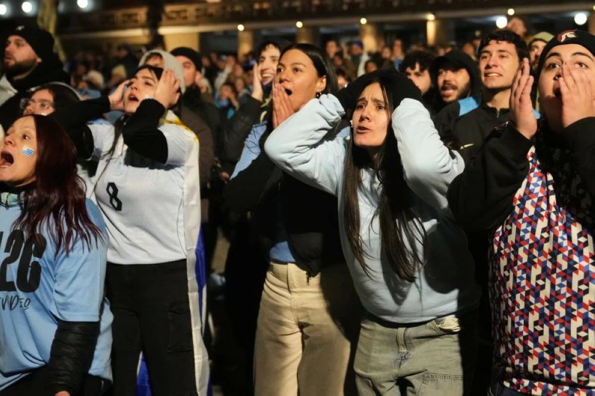 Fans watch the World Cup soccer match between Uruguay and Saudi Arabia, in Montevideo, Uruguay Monday, June 15, 2026. (AP)