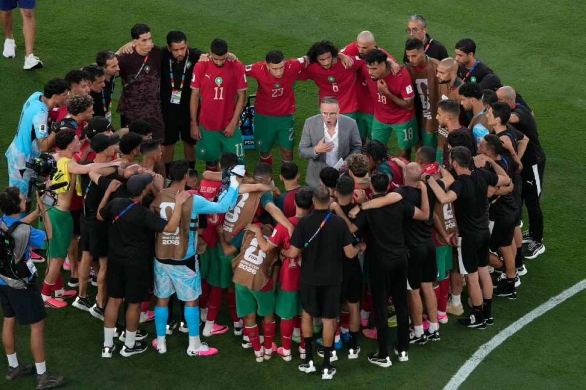 Morocco head coach Mohamed Ouahbi talks with his team following their World Cup Group C soccer match against Brazil in East Rutherford, N.J. File photograph. Picture credit: AP