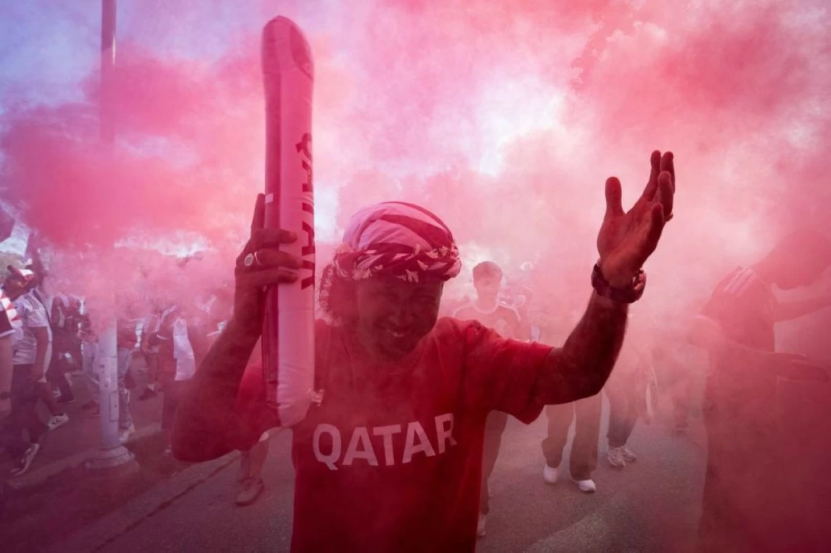 Qatari fans march during a World Cup rally in Vancouver, British Columbia, Wednesday, June 17, 2026. (AP)