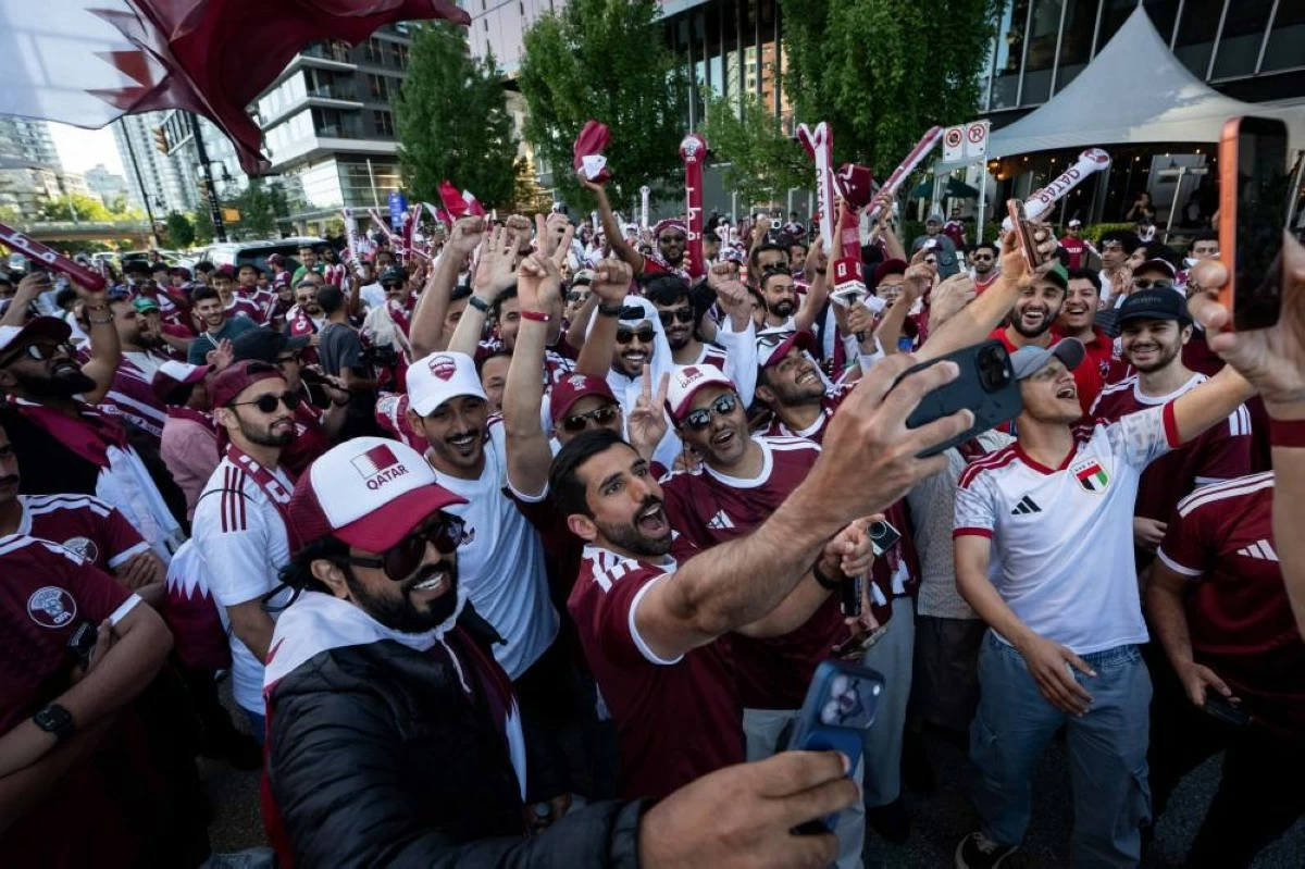 Qatari fans chant before marching during a World Cup rally in Vancouver, British Columbia, Wednesday, June 17, 2026. (AP)
