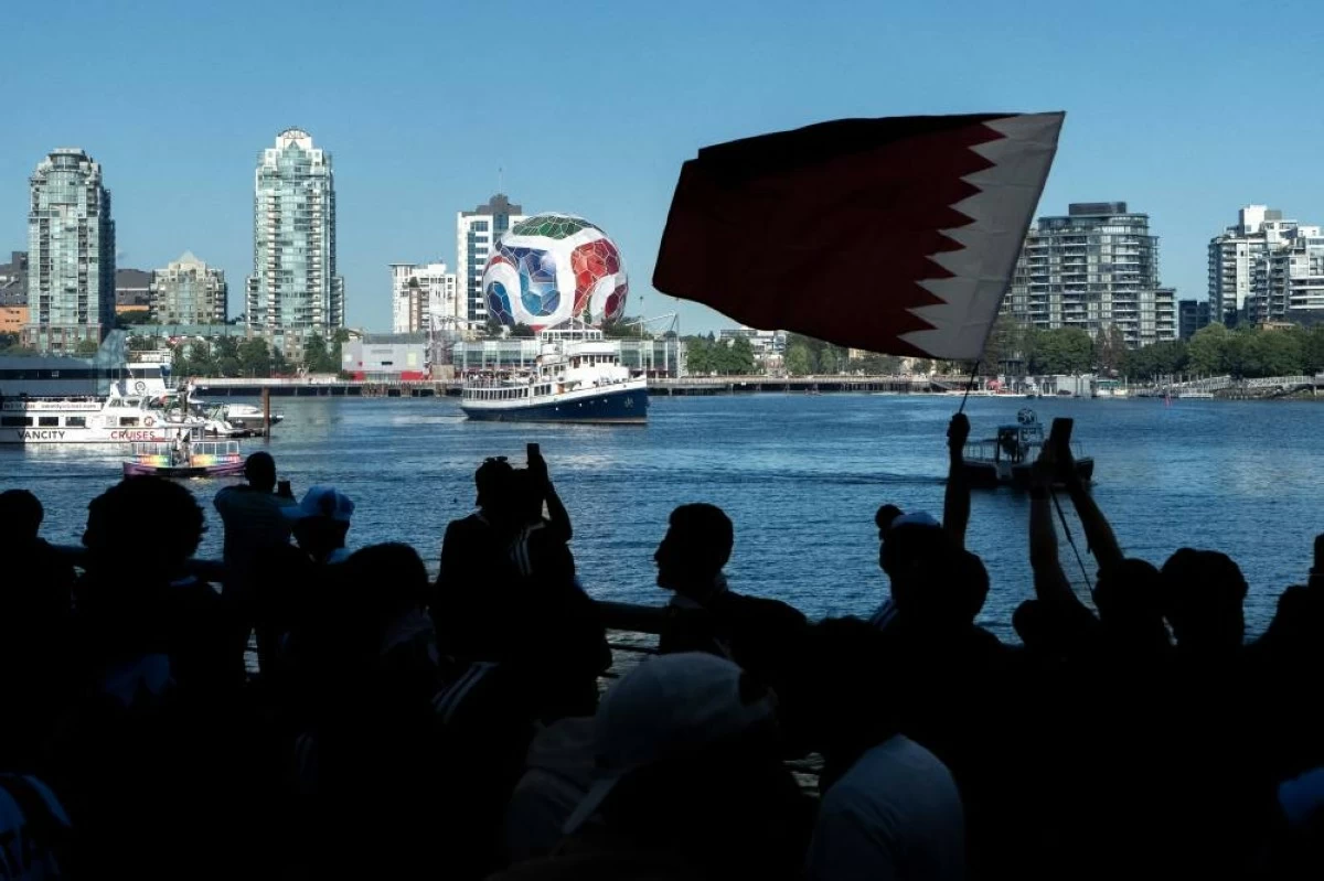 Qatari fans march during a World Cup rally in Vancouver, British Columbia, Wednesday, June 17, 2026. (AP)
