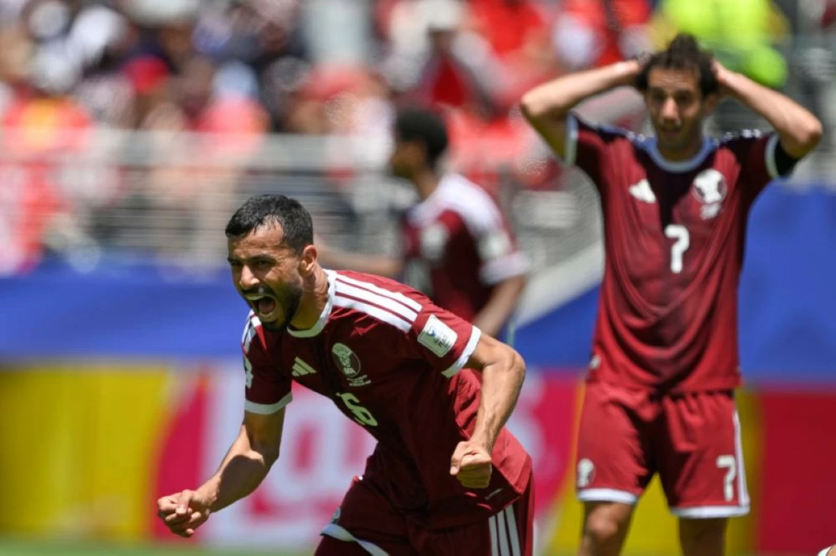 Qatar's Boualem Khoukhi celebrates after scoring his sides first goal during the World Cup Group B soccer match between Qatar and Switzerland in Santa Clara, California. File photograph. Picture credit: AP