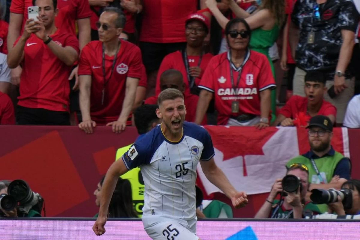 Bosnia's Jovo Lukic celebrates after he scores the opening goal during the World Cup Group B soccer match between Canada and Bosnia in Toronto. File photograph. Picture credit: AP