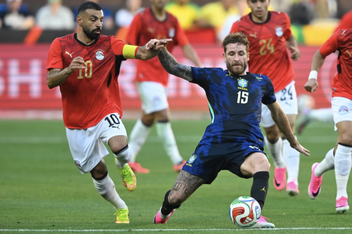 Egypt’s Mohamed Salah (10) runs beside Brazil’s Léo Pereira (15) during an international friendly soccer match in Cleveland, Saturday, June 6, 2026. Picture credit: AP