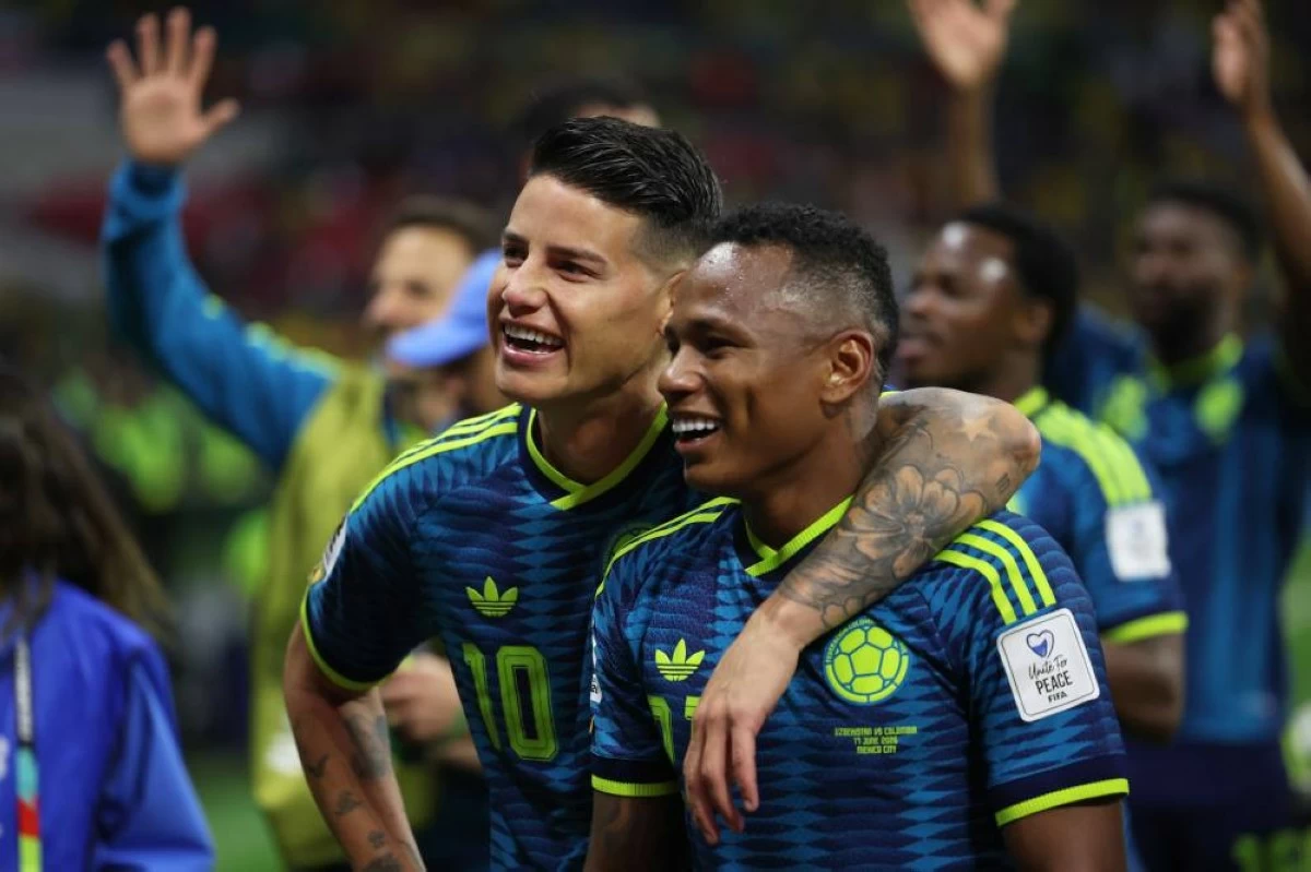 Colombia's James Rodriguez (10) and Jaminton Campaz (21) celebrate after their win in the World Cup Group K soccer match between Uzbekistan and Colombia in Mexico City. Picture credit: AP
