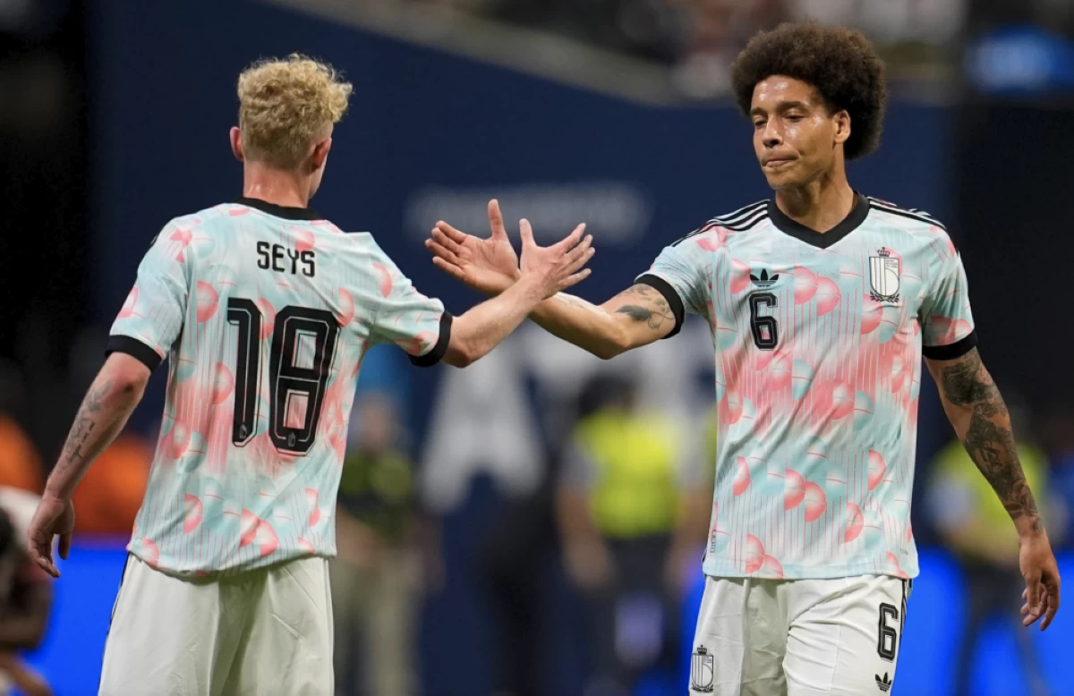 Belgium’s Joaquin Seys (18) and Axel Witsel celebrate after defeating the United States in an international friendly soccer match, Saturday. Picture credit: AP