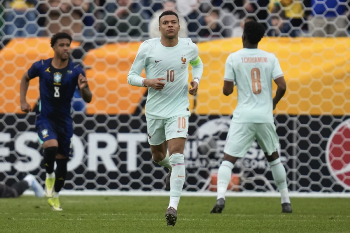Kylian Mbappe of France runs during the international friendly soccer match between Brazil and France in Foxborough, Mass. Picture credit: AP