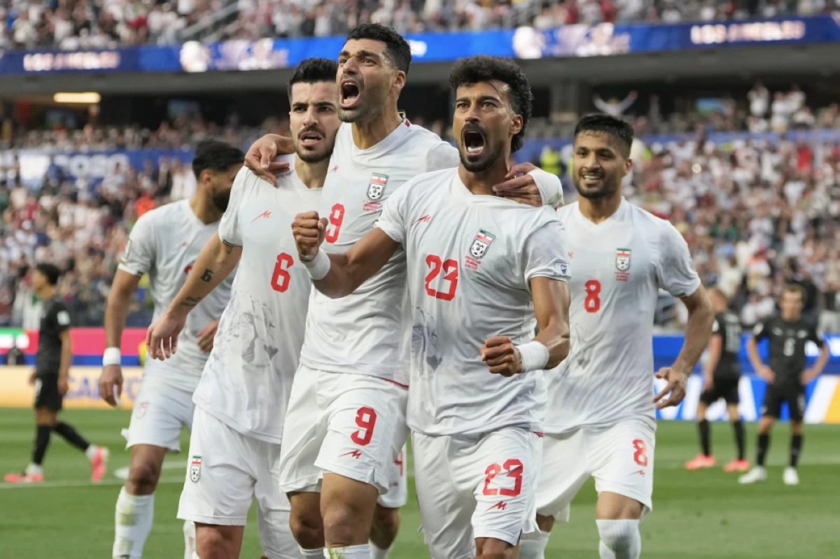 Iran’s Ramin Rezaeian (23) celebrates with his teammates after scoring a goal during the World Cup Group G soccer match between Iran and New Zealand in Inglewood, Calif. Picture credit: AP