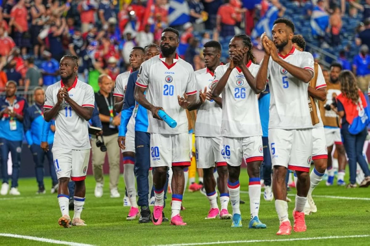 Haiti players react to fans following the World Cup Group C soccer match between Haiti and Scotland in Foxborough, Mass. Picture credit: AP