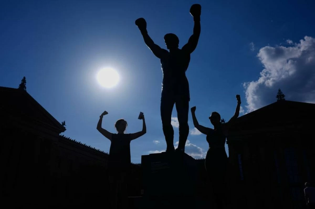 Brazilian soccer fans at the World Cup heed warning not to dress Rocky statue in team gear