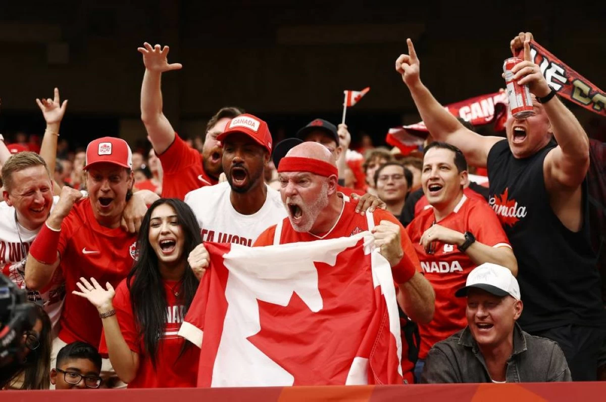 Canada fans celebrate after Jonathan David scored their sixth goal to complete his hat-trick. Picture credit: Reuters