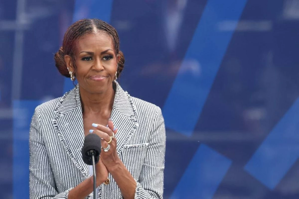 Former U.S. first lady Michelle Obama applauds after speaking during a dedication ceremony for the opening of the Obama Presidential Center, in Chicago, Illinois, U.S., June 18, 2026. REUTERS