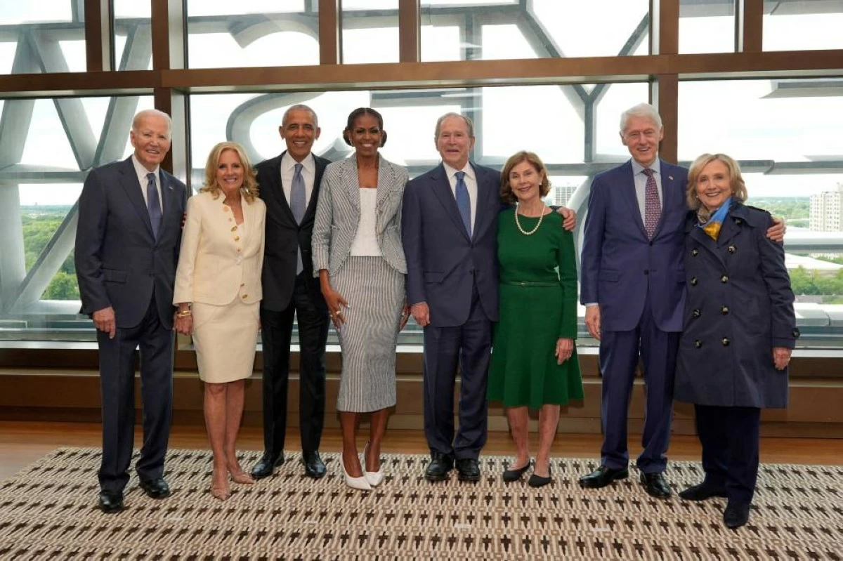 Former U.S. presidents Joe Biden, Barack Obama, George W. Bush, Bill Clinton, and former first ladies Jill Biden, Michelle Obama and Laura Bush, and former first lady and Secretary of State Hillary Clinton pose for a photo ahead of the dedication ceremony at the Obama Presidential Center, in Chicago, Illinois, U.S., June 18, 2026. REUTERS