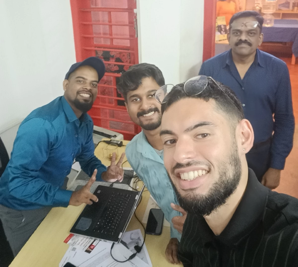 Nayakam with his colleagues at the Alliance Française office in Kerala, India.