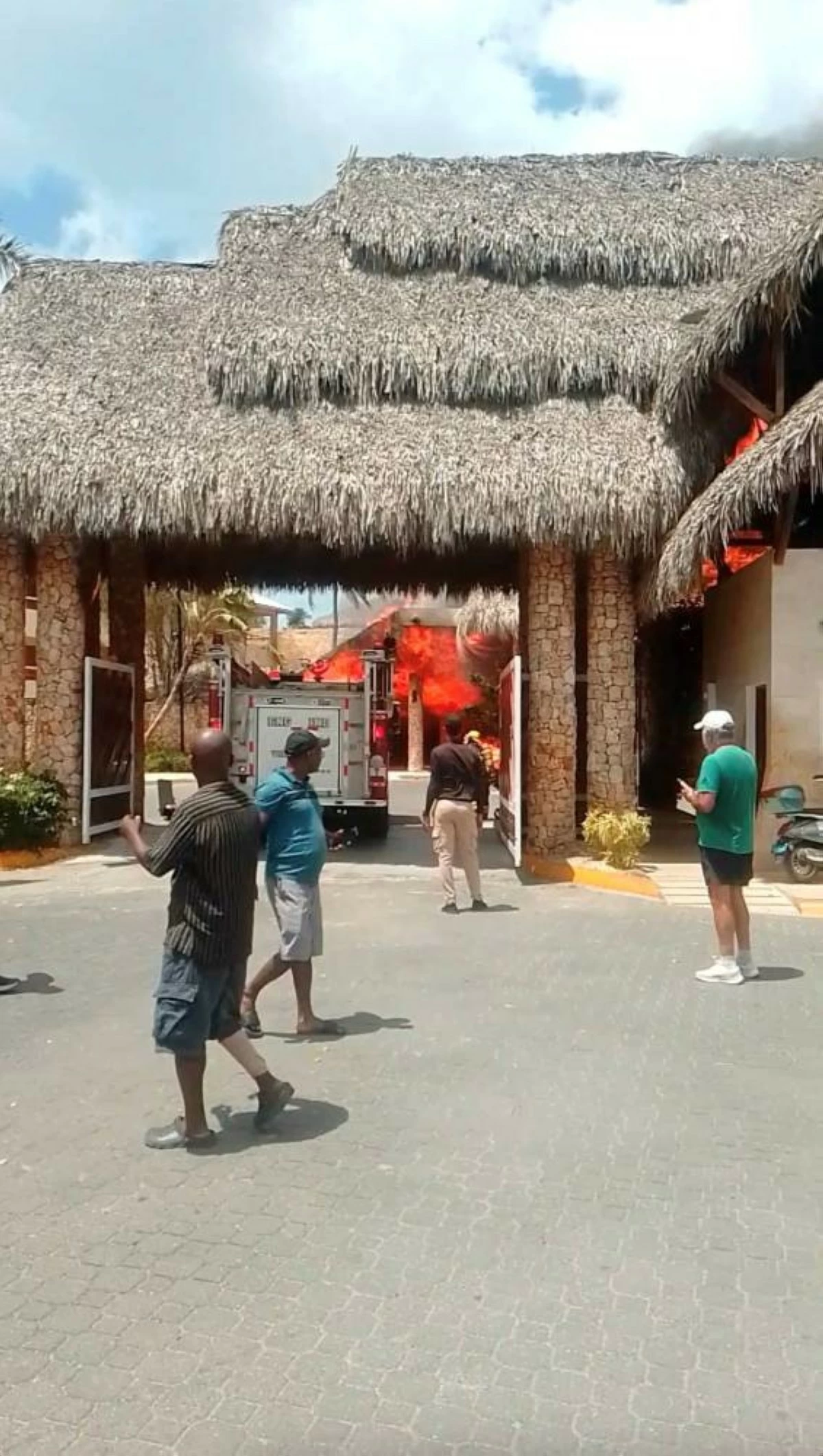 People look at a fire at Viva Dominicus resort in Bayahibe, La Altagracia, Dominican Republic, June 19, 2026, in this still taken from a social media video. Junito Mieses/via REUTERS