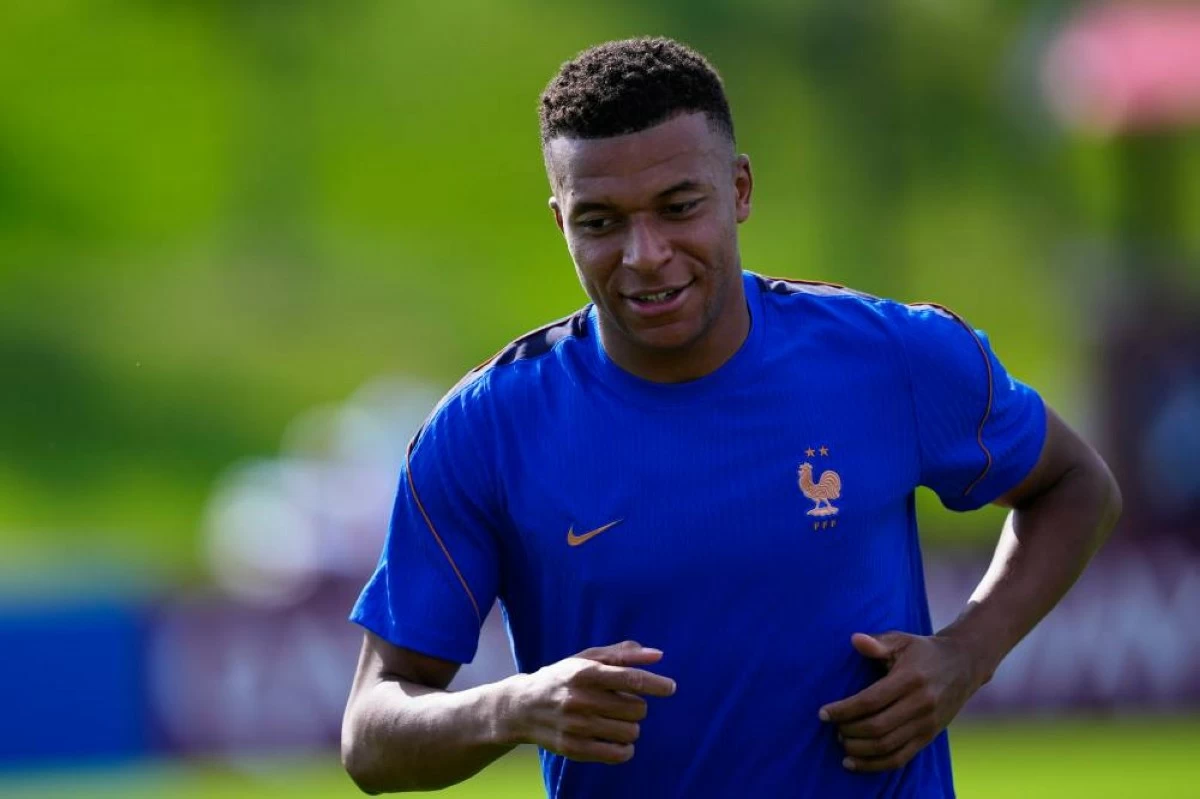 France's Kylian Mbappe runs during a training session. AP