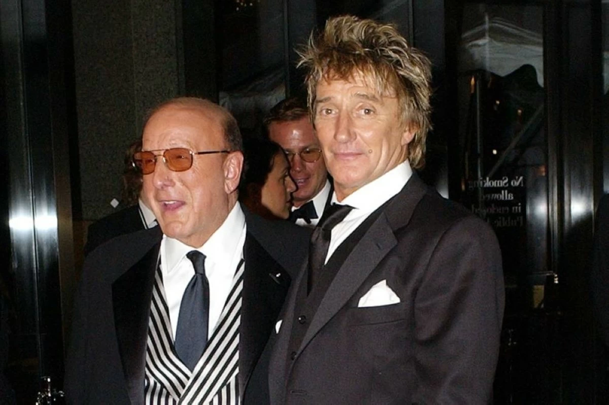 Record producer Clive Davis, left, and rock singer Rod Stewart arrive at Davis' pre-Grammys gala in New York on Feb. 22, 2003. File photograph/AP